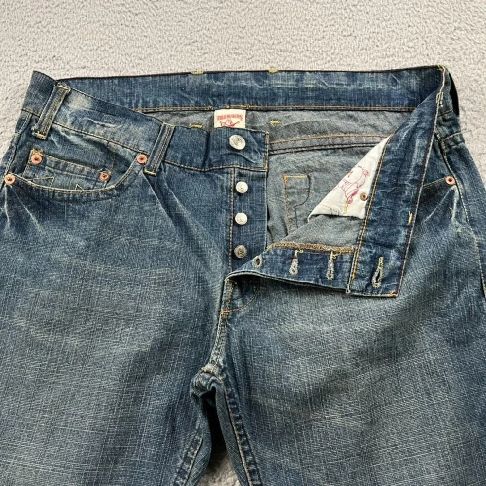 True Religion Logan Jeans Men 38 Blue Button Fly Distressed Split Hem‎ Whiskers